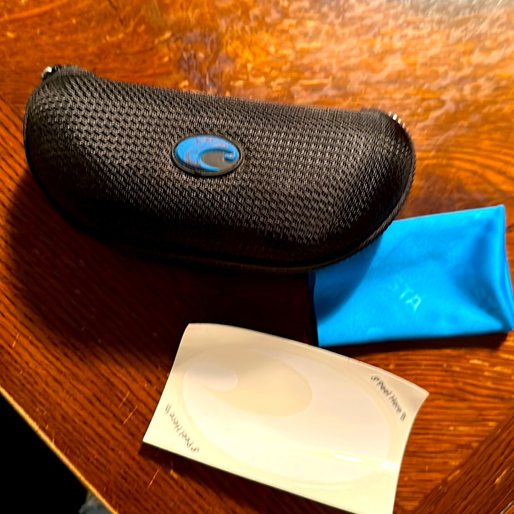 Costa sunglasses holder and cleaning cloth. Sticker included.